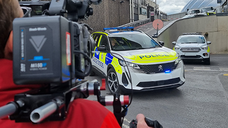 Behind the scenes filming of a police car